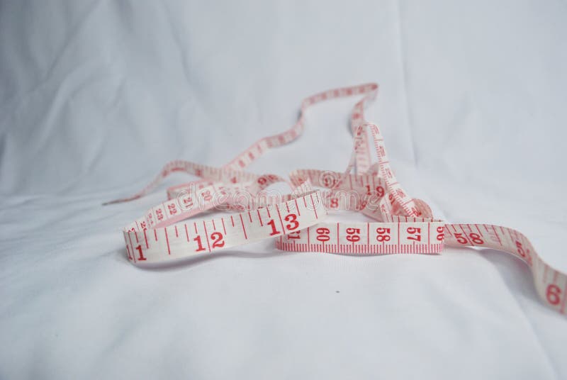 Measuring lint with red numbers on white background