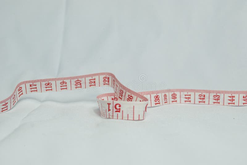 Measuring lint with red numbers on white background