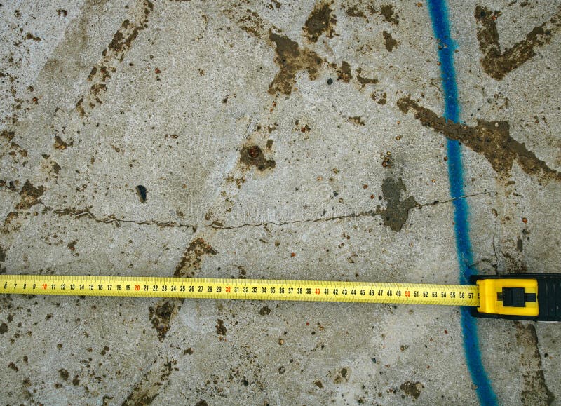 Measuring Ruler on a Concrete Wall Texture Stock Image Image of messy
