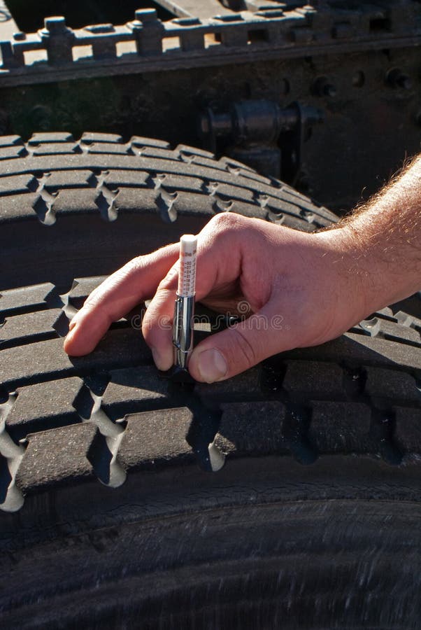 Measuring tread depth tractor-trailer truck tire