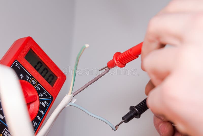 Measuring Voltage with a Multimeter and Repairing Electrical Equipment