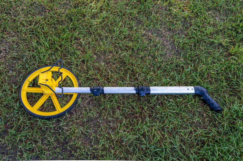 Measuring Wheel Device Laying in the Grass Stock Photo Image of