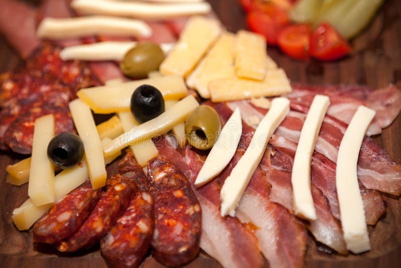 Meat Appetizer with Bacon, Sausage, Olives and Cheese Stock Image