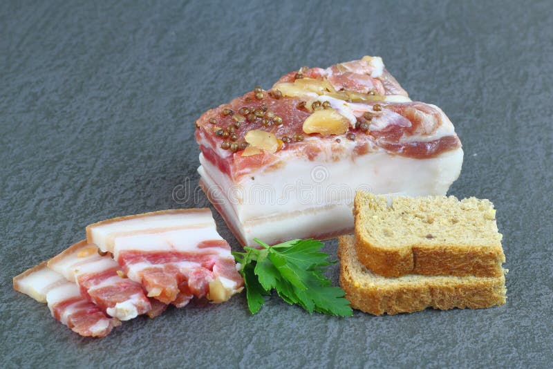 Meat Appetizer. Smoked Meat with Pepper and Garlic. Small Slices on