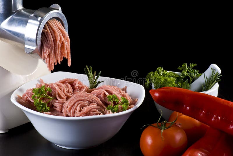 Meat grinder with mince and vegetables