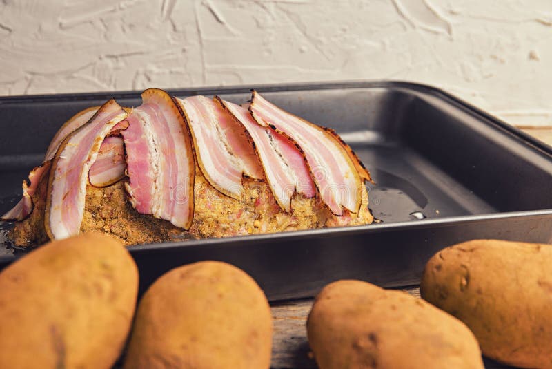 Meat Loaf With Slices Of Bacon. Homemade Meat Loaf On Roasting Pan