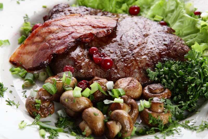 Meat with mushrooms stock image. Image of main, berries 25320243