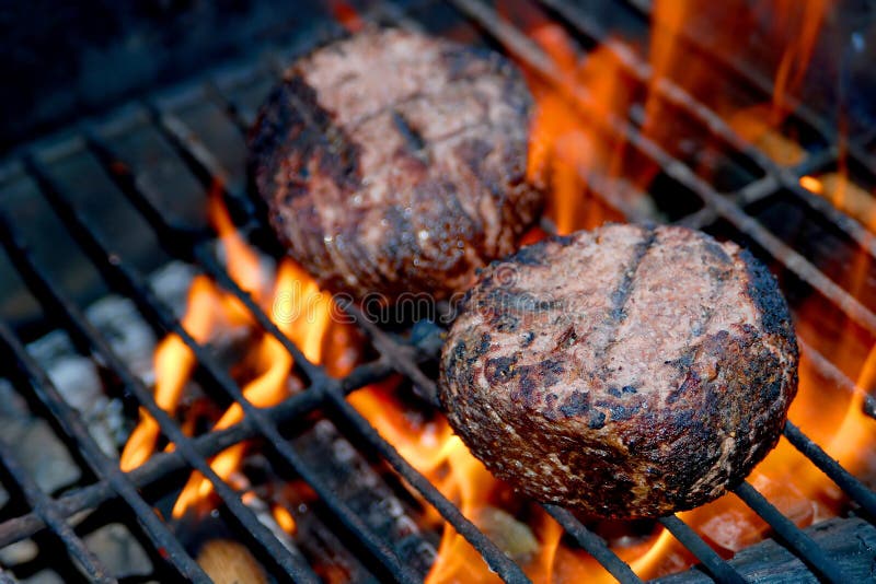 Meat Patties on Flaming Grill