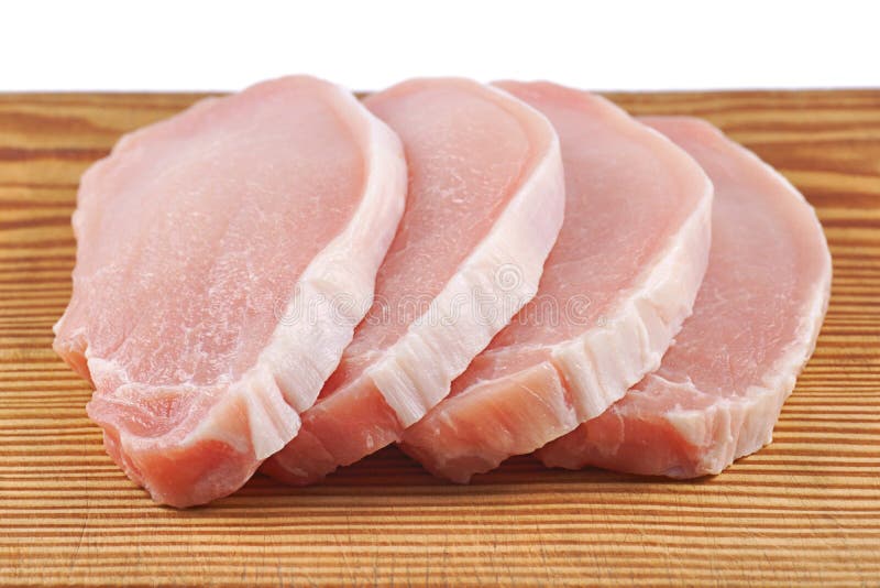 Meat, pork, slices pork loin on wooden board and white background royalty free stock image Meat, pork, slices pork loin on wooden board and white background royalty free stock image