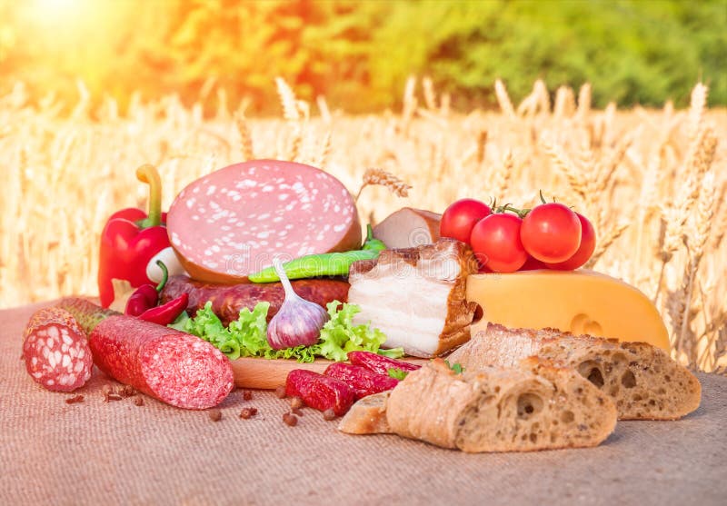 Meat products.Smoked ham,sausage,bacon,vegetables royalty free stock photo Meat products.Smoked ham,sausage,bacon,vegetables royalty free stock photo