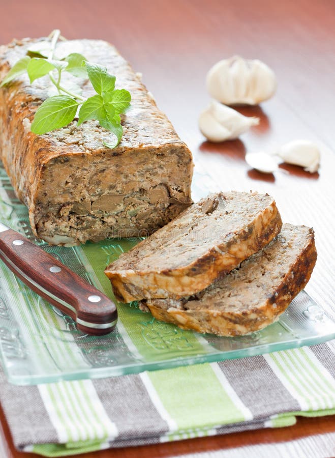 Meat roll with basil leaves