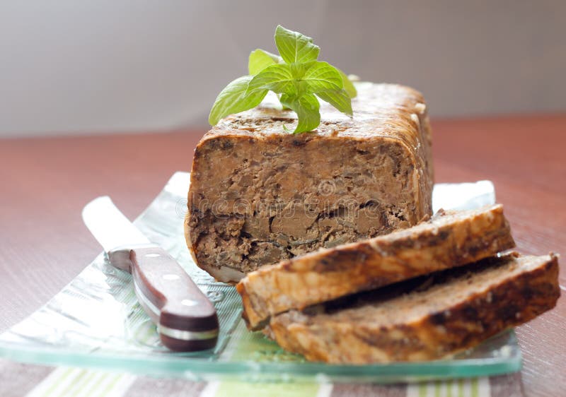 Meat roll with basil leaves