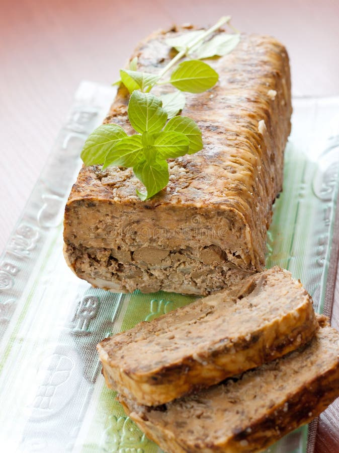 Meat roll with basil leaves