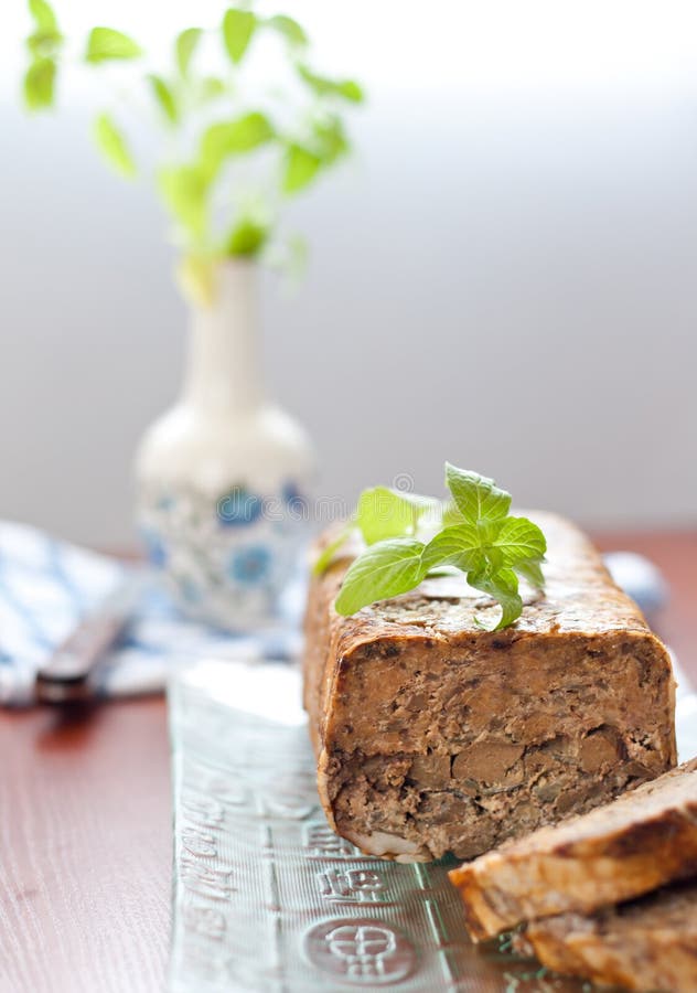 Meat roll with basil leaves