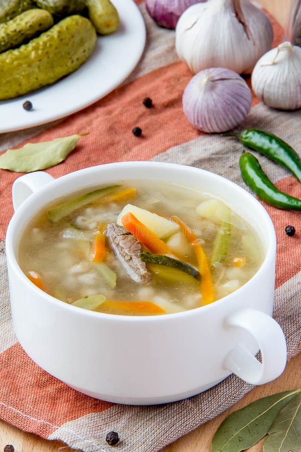 Meat soup with pickled cucumbers and pearl barley royalty free stock photos