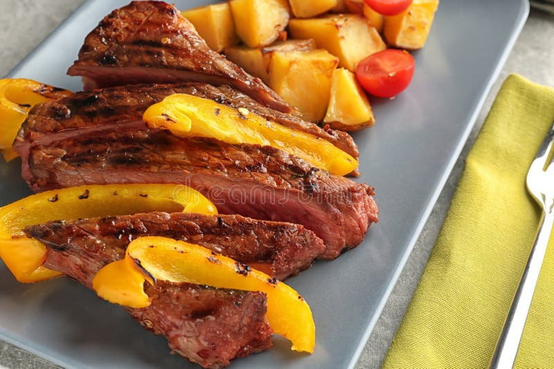 Meat with Vegetable Garnish on Plate, Closeup Stock Image Image of