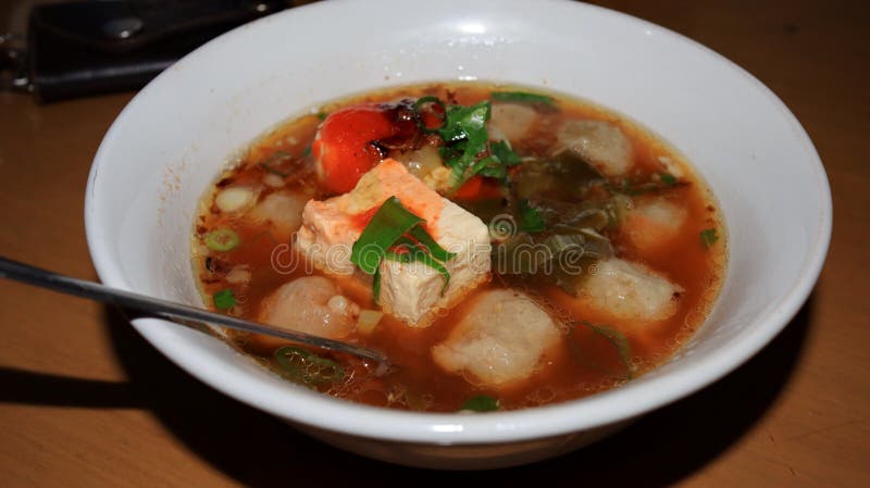 Meatball street food vendor. Variation of Meatball or bakso in boiling pan with soup in the centres. Meatball street food vendor. Variation of Meatball or bakso in boiling pan with soup in the centres