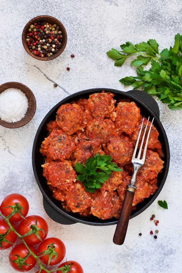 Meatballs with Tomato Sauce and Spices in a Pan on the Kitchen Table