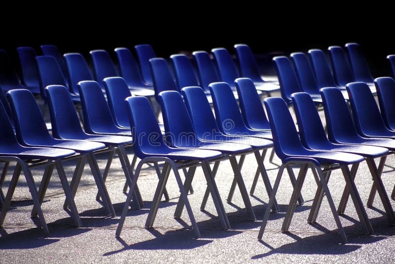 Outdoor shot of blue chairs in a row. Outdoor shot of blue chairs in a row