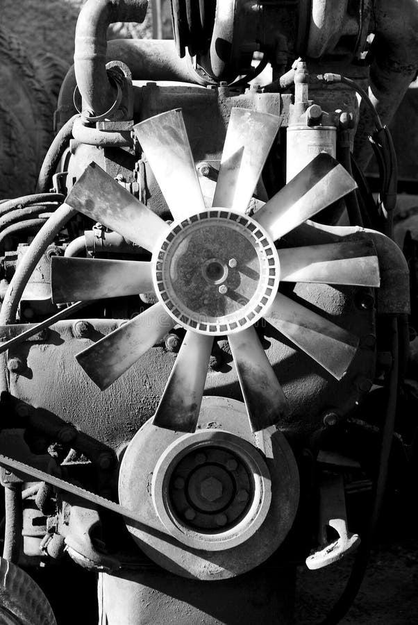 Old rusty car engine sitting outside an automotive repair shop. black and white. Old rusty car engine sitting outside an automotive repair shop. black and white