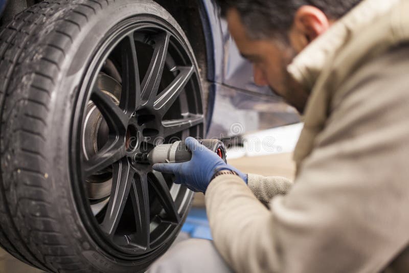 The mechanic works in the workshop stock image The mechanic works in the workshop stock image