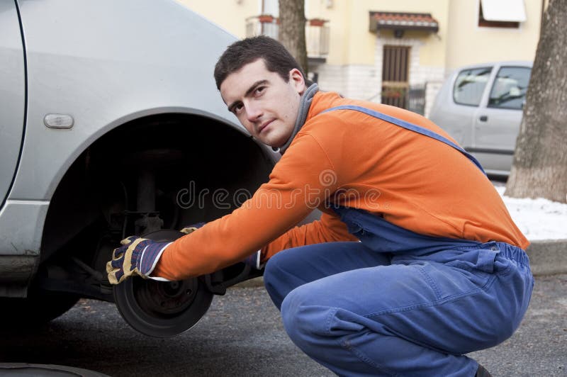 Man worker on a car wash stock photo. Image of spraying 49119934