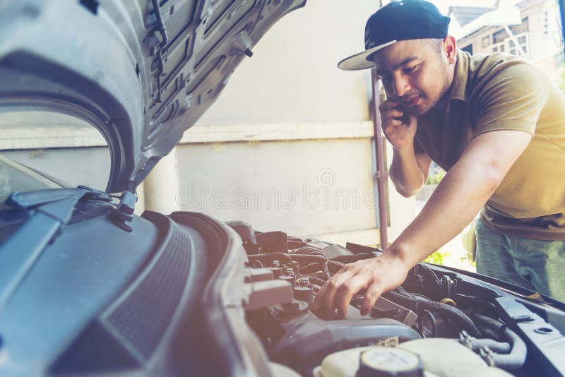 Mechanic Car Service in automobile garage auto car and vehicles service mechanical engineering. Automobile mechanic hands car