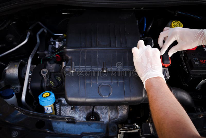 Mechanic checks auto electronic control unit stock photo