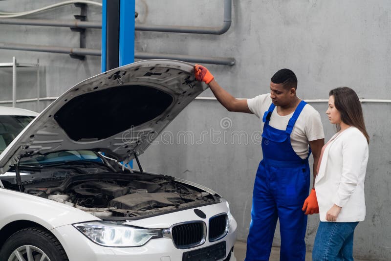 Mechanic and Client Inspect Engine of Car Stock Photo Image of