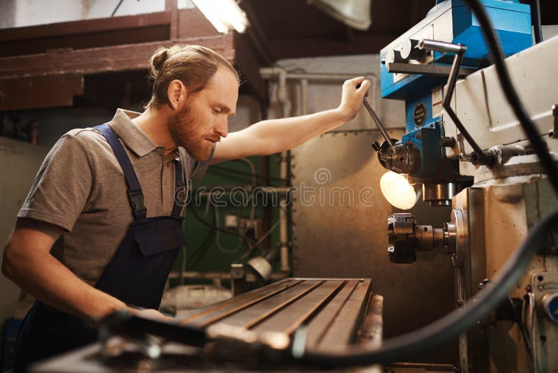 Mechanic Controls the Machine Stock Photo Image of repairing