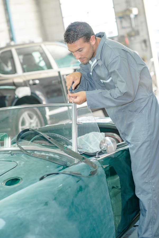 Mechanic Doing Up Windshield on Classic Car Stock Photo Image of