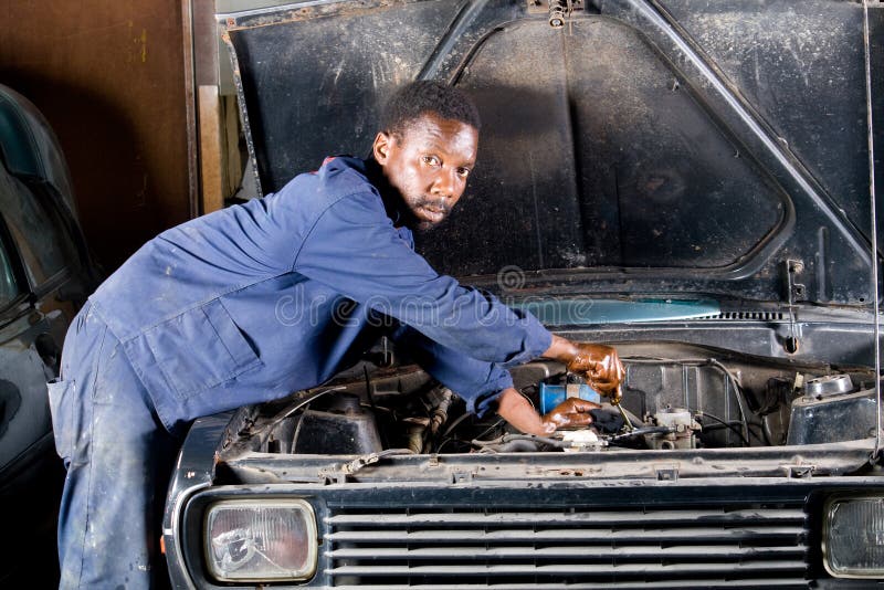 Mechanic fixing car royalty free stock photography