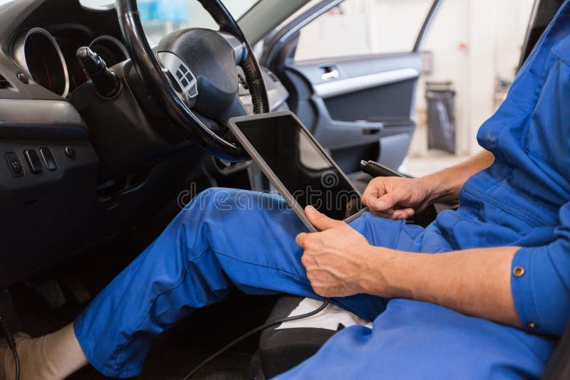 Mechanic Man With Tablet Pc Making Car Diagnostic Stock