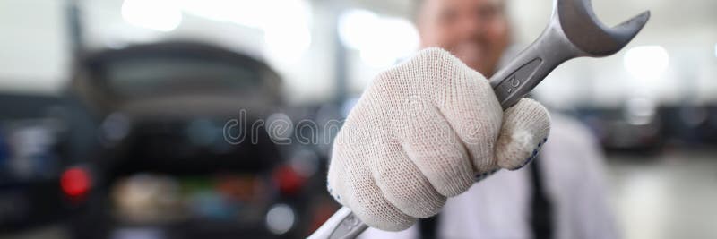 Mechanic with metal wrench