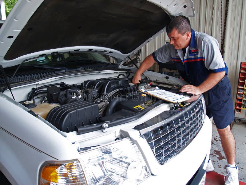 Mechanic Performing a Routine Service Inspection Stock Image Image of