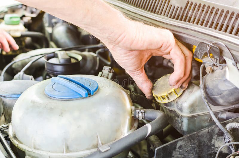 The Mechanic`s Hands Performing a Car Engine Check Stock Photo Image
