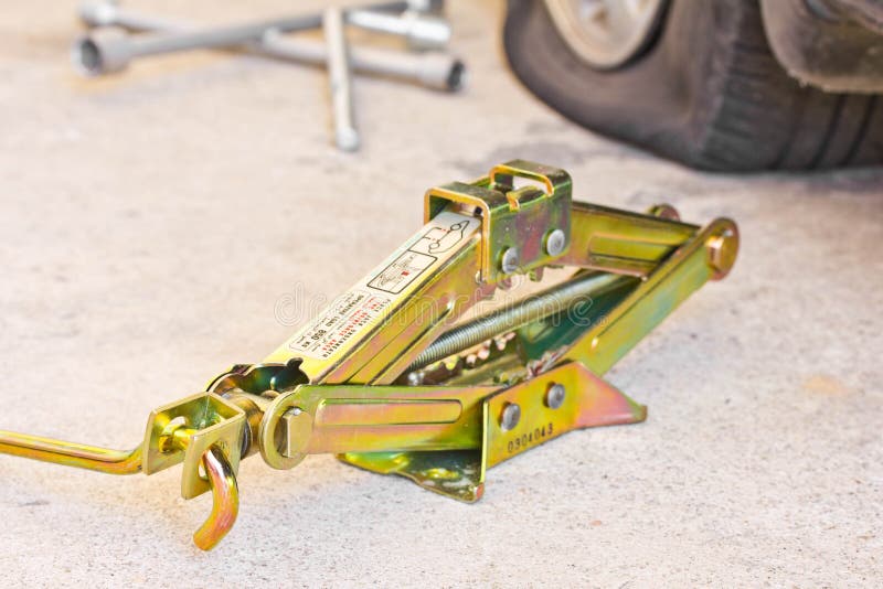 Mechanic sets a jackscrew stock image. Image of outdoors 30828165