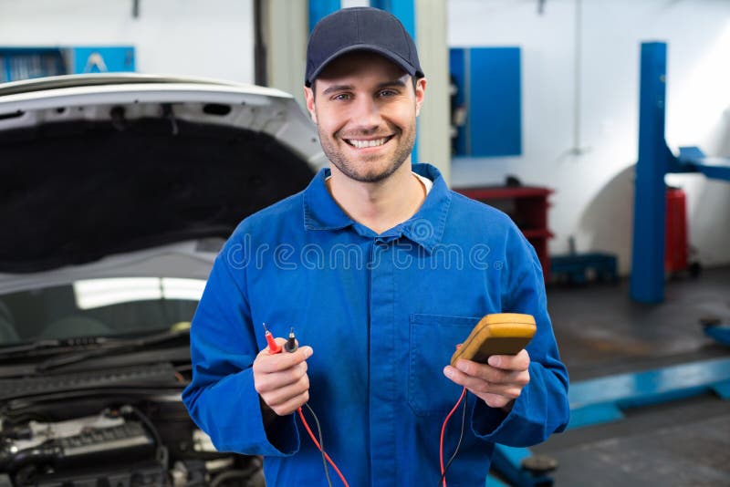 Mechanic Smiling at the Camera Holding Tool Stock Photo Image of