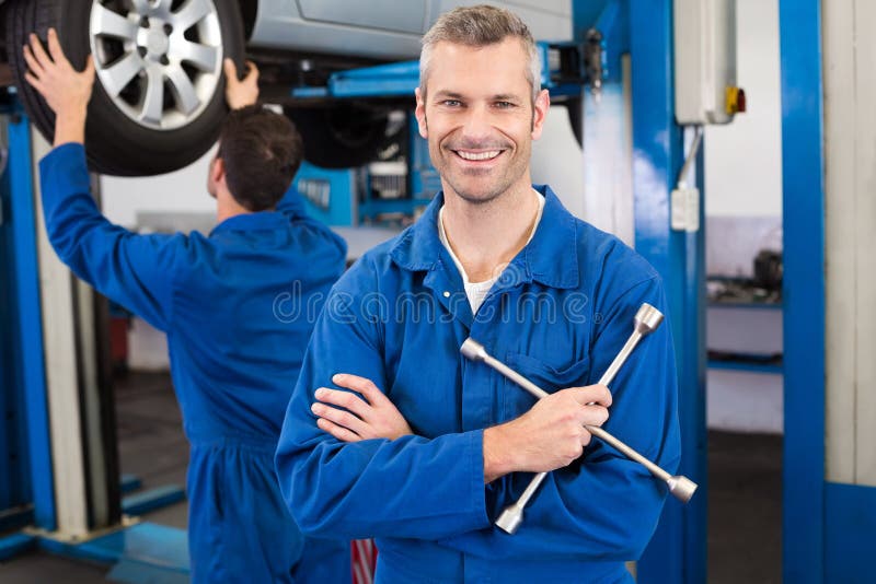 Mechanic Smiling at the Camera Stock Photo Image of cheerful, adult