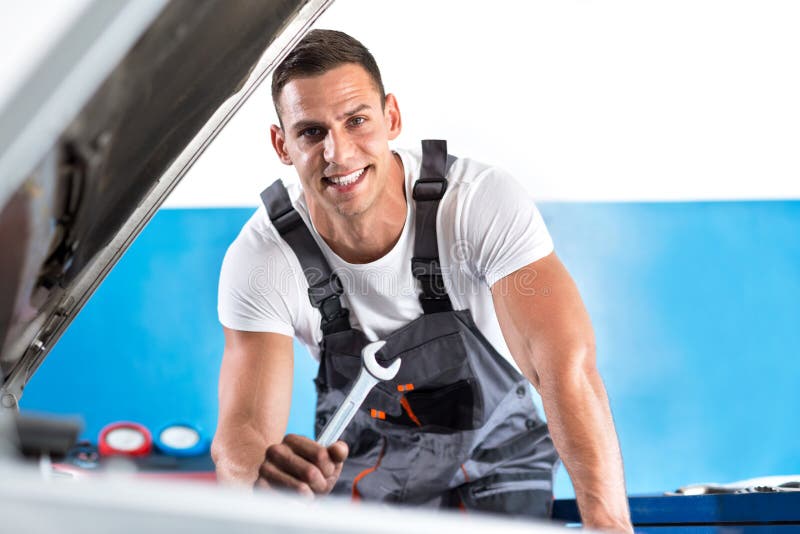 Mechanic with spanner stock photo. Image of broken, garage 73439458
