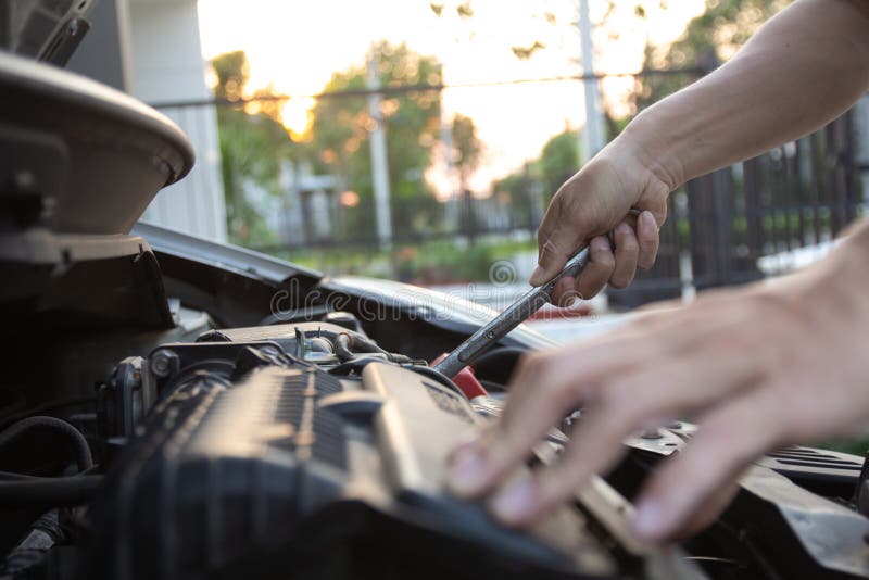 Mechanic, Technician Man Holding Spanner Checking Car Engine. Car