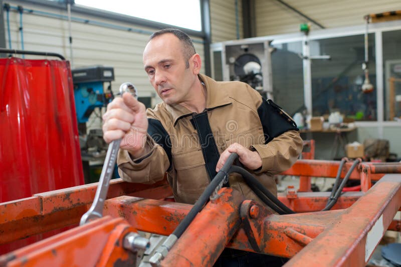 Mechanic using large spanner stock photos Mechanic using large spanner stock photos