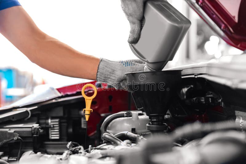 Mechanic Working on Checking and Service Car in Garage, Engine