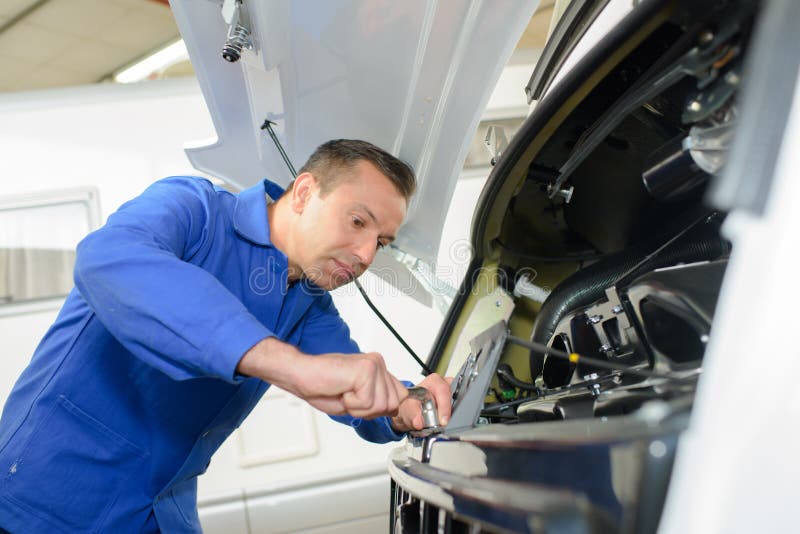 Mechanic Working on Front Motor Caravan Stock Photo Image of tighten