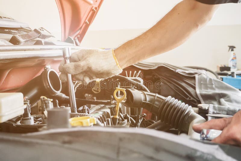 Mechanic Working and Repair Car in Car Service Centre Stock Photo