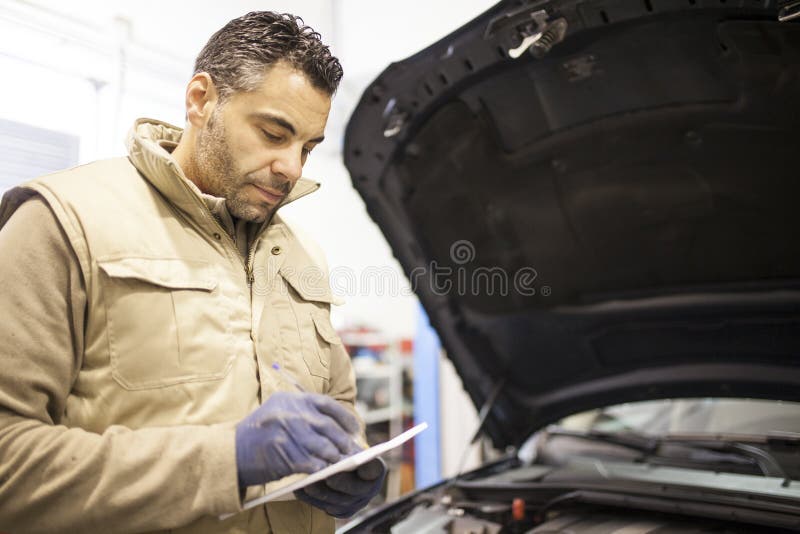 The mechanic works in the workshop stock images The mechanic works in the workshop stock images