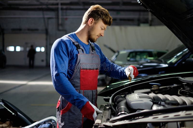 Mechanic in a stock image. Image of dealer, automotive 60538713