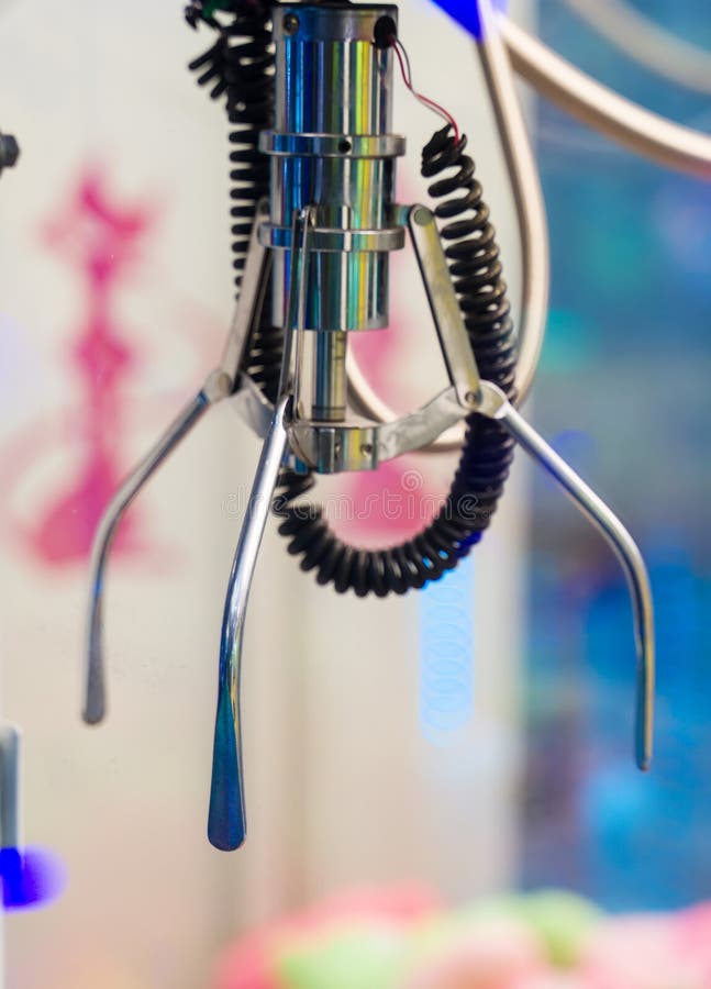 Mechanical claw game machine. royalty free stock photography Mechanical claw game machine. royalty free stock photography
