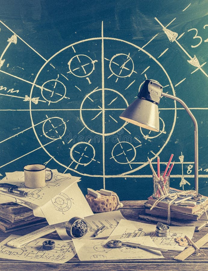 Mechanical engineer desk at the school on green chalkboard background royalty free stock photo Mechanical engineer desk at the school on green chalkboard background royalty free stock photo