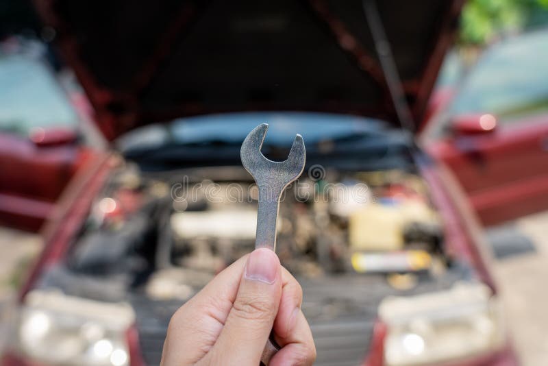 Mechanical engineer hands open the car skirt to check the oil level of the car. The concept of engine maintenance Travel safely royalty free stock photo Mechanical engineer hands open the car skirt to check the oil level of the car. The concept of engine maintenance Travel safely royalty free stock photo